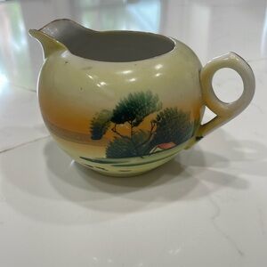 Vintage hand painted creamer. In excellent condition.